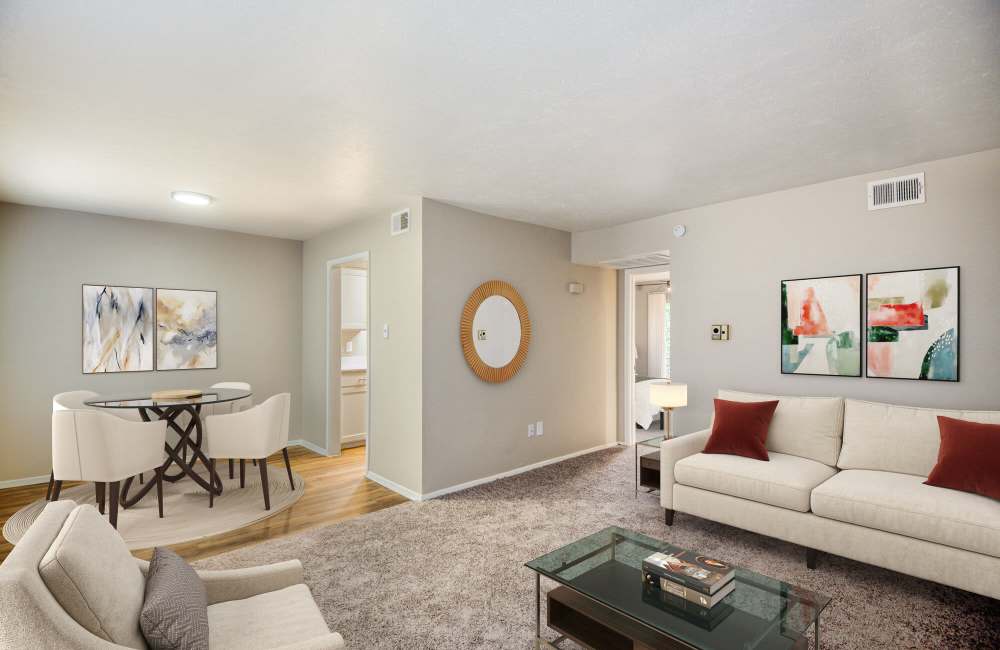 Spacious living room with couch, coffee table and plush carpeting at Lakeridge Heights in Dallas, Texas, 
