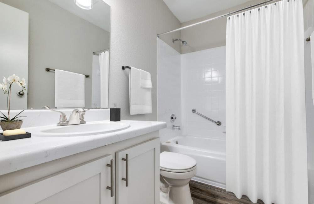 Bright bathroom with shower and tub at Northside Heights in Conroe, Texas