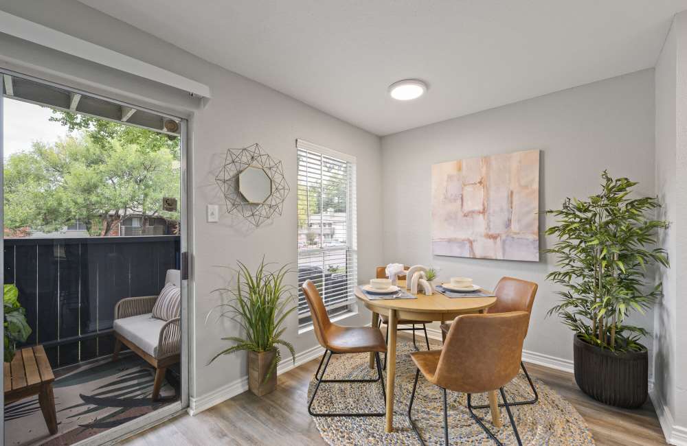 Dining area and a door leading to the balcony at Northside Heights in Conroe, Texas