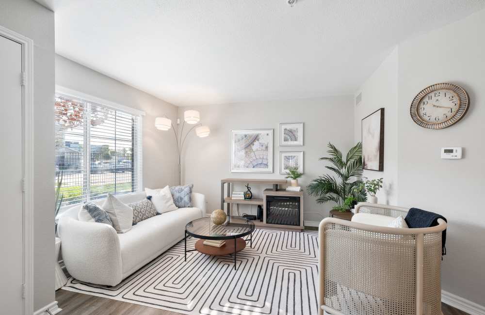 Spacious living room with sliding glass doors for patio access at Park At Woodmoor Apartments in Shenandoah, Texas, 
