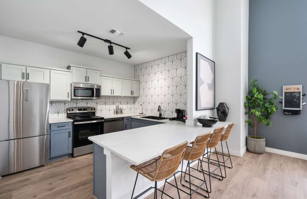 Community kitchen area for entertaining at Park At Woodmoor Apartments in Shenandoah, Texas, 