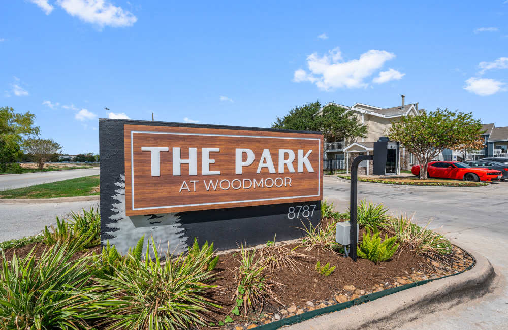 Front entrance sign at Park At Woodmoor Apartments in Shenandoah, Texas, 