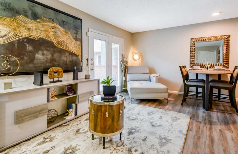 Spacious living room with wood-style flooring and dining area by the side at South Shore Coastal Living in Corpus Christi, Texas, 