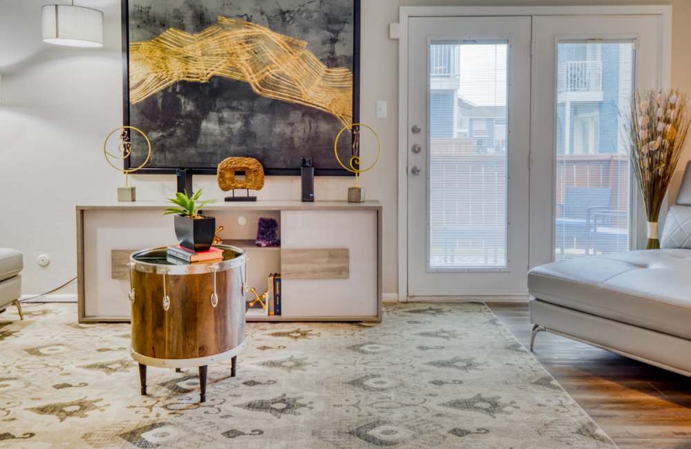 Premium-looking living room with white sofa and designer floor carpet at South Shore Coastal Living in Corpus Christi, Texas, 