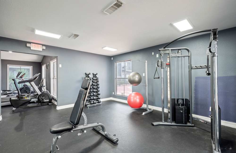 Well-lit fitness studio at North Bend Living in Houston, Texas