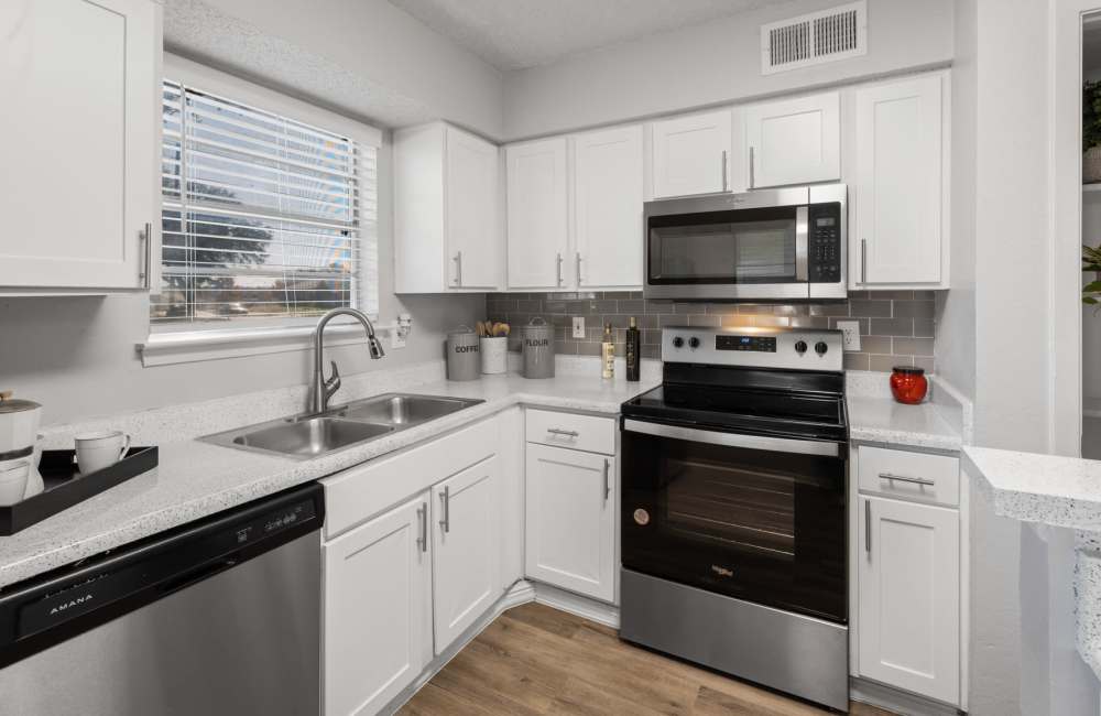 Apartment kitchen with stainless-steel appliances at 18Eleven Frankford in Carrollton,Texas