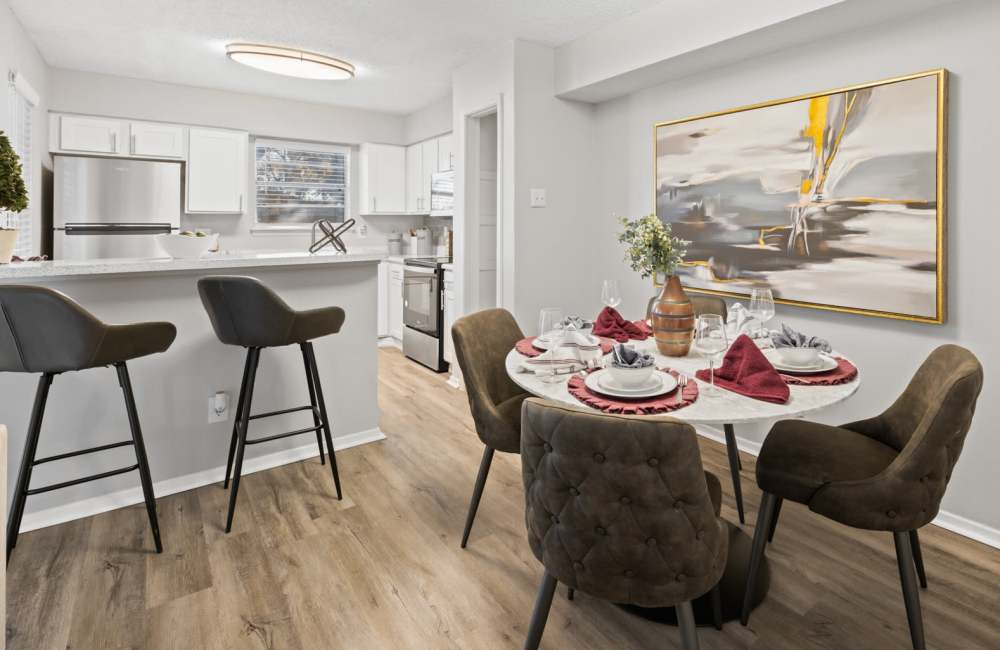 Four-seater dining table setup beside the kitchen at 18Eleven Frankford in Carrollton,Texas