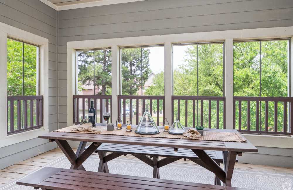 Private balcony with a bench at The Park Apartment Homes in Prattville, Alabama