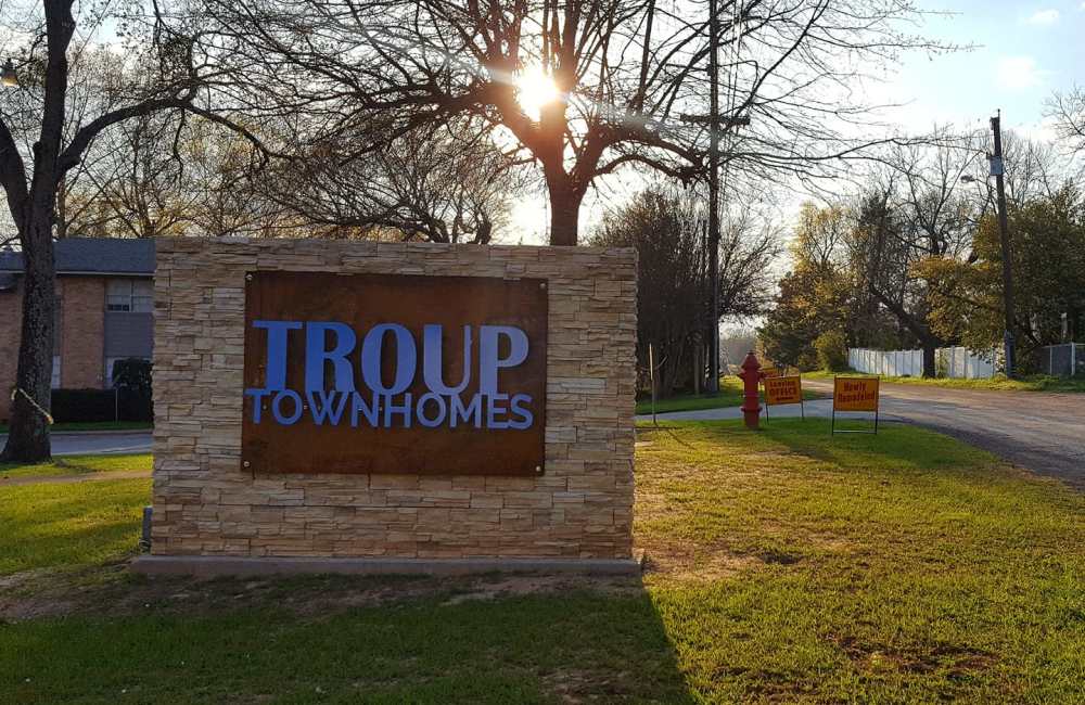 Front entrance sign at Troup Townhomes in Troup, Texas