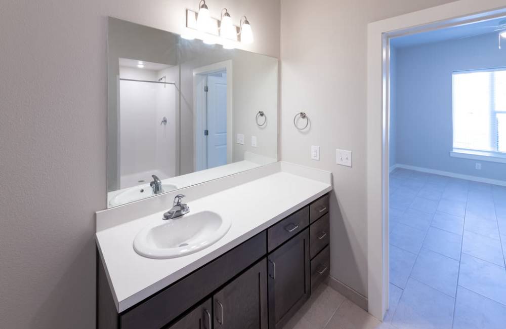 Briight bathroom onnected to the bedroom at The Loretta in Austin, Texas, 