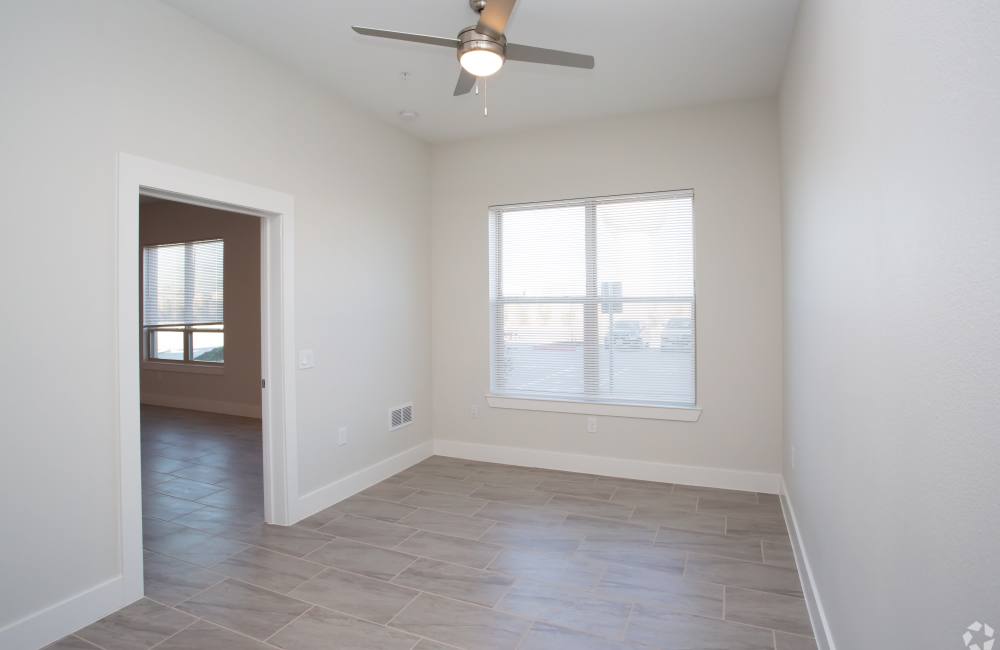 Bedroom with ceiling fan at The Jordan at Mueller in Austin, Texas