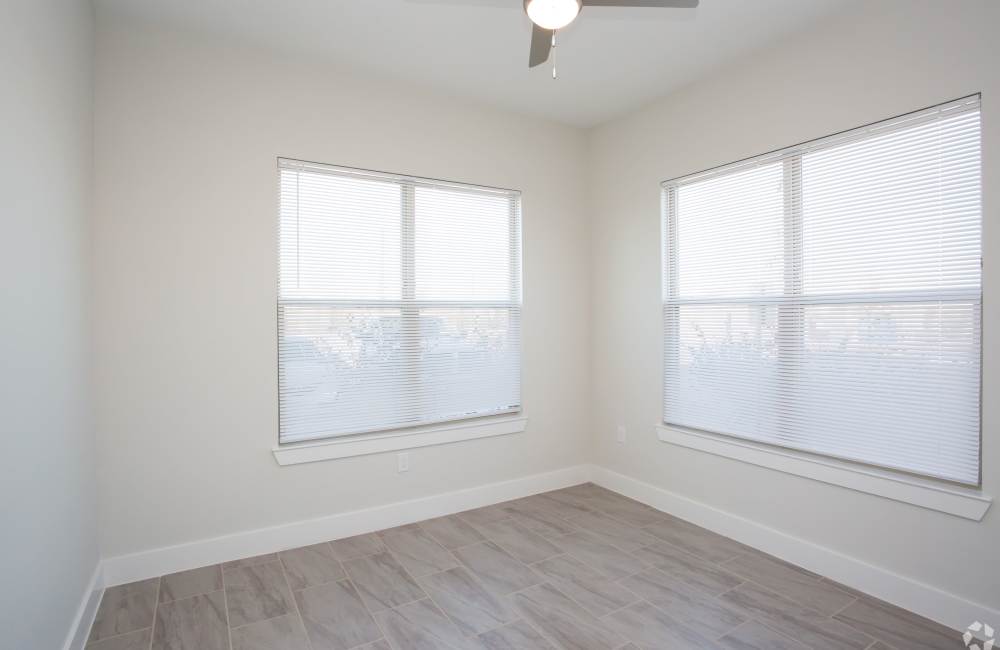 Bedroom with large windows at The Jordan at Mueller in Austin, Texas