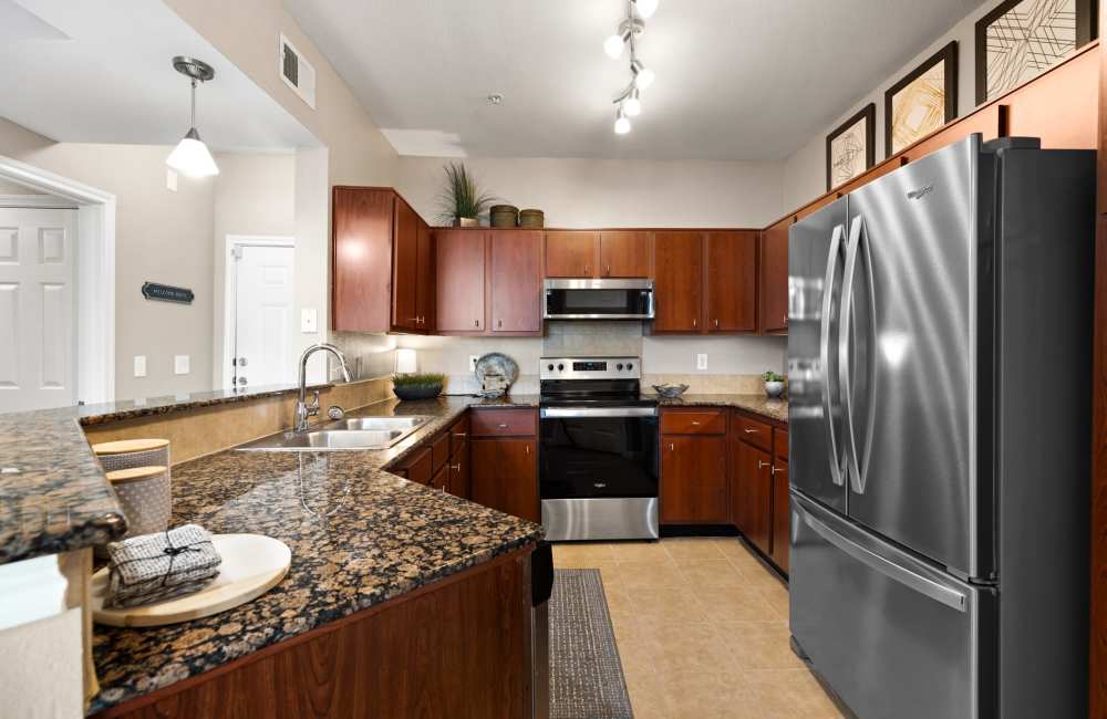 Modern kitchens with stainless steel appliances at The Abbey on Lake Wyndemere in The Woodlands, Texas