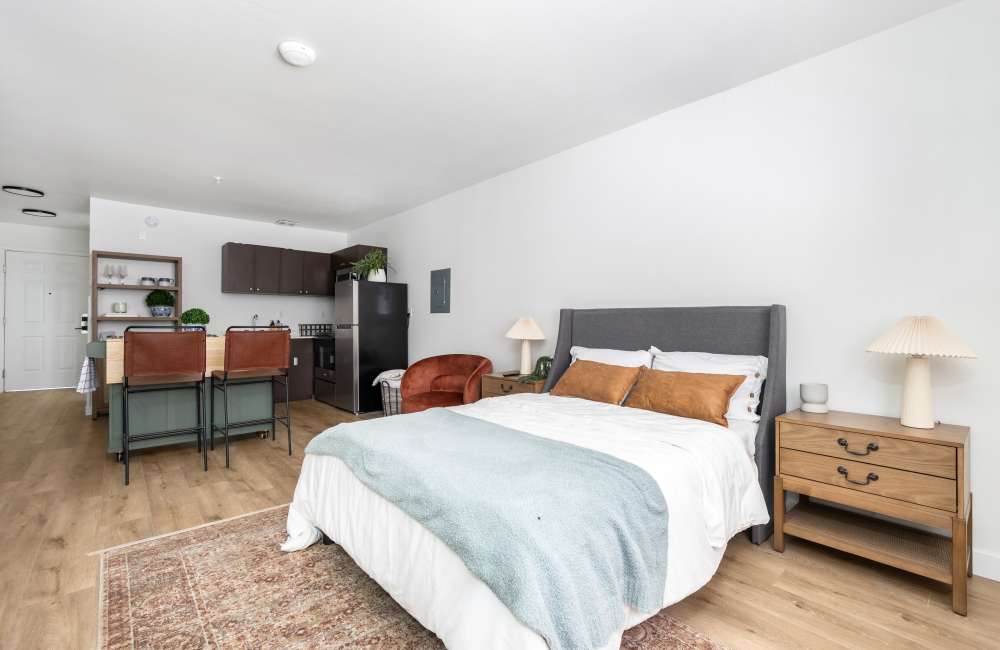 Bed In Furnished Model Apartment at The Varsity in Centralia, Washington