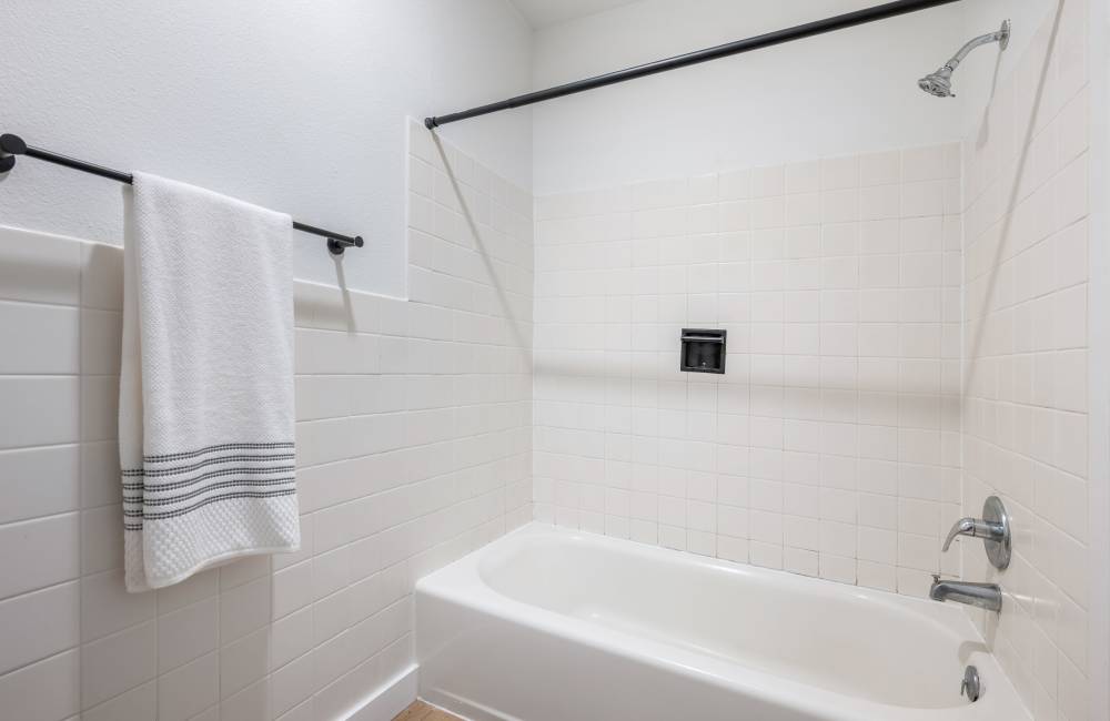 Bathroom With Tub In Studio Apartment at The Varsity in Centralia, Washington