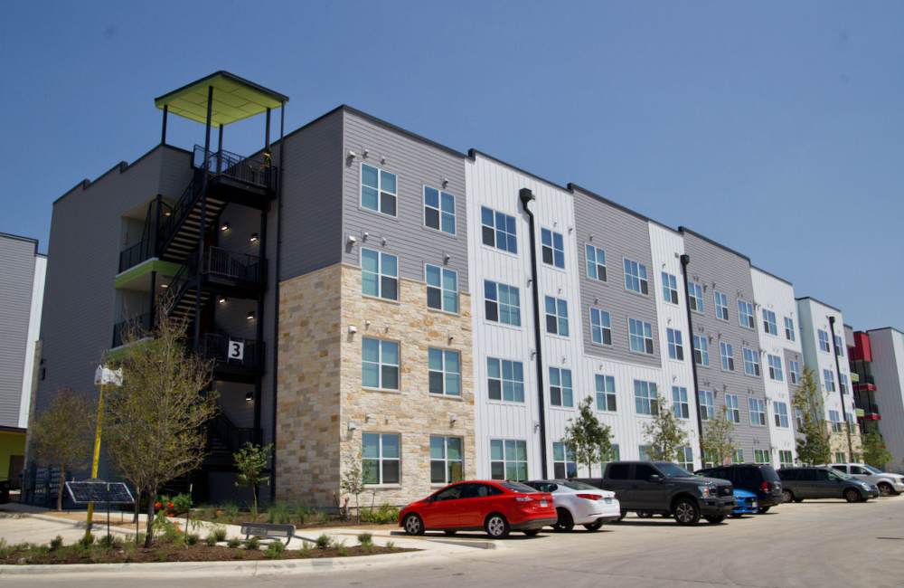 Apartment view with parking cars at Norman Commons in , Texas