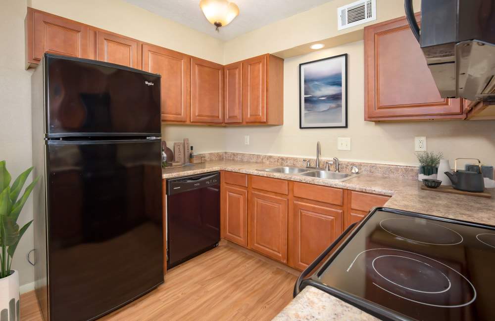 Kitchen with dishwasher at Council Crossing in Bethany, Oklahoma