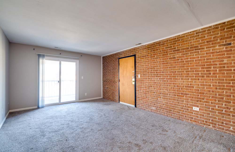 Living room with windows at The Commons at Kettering in Dayton, Ohio