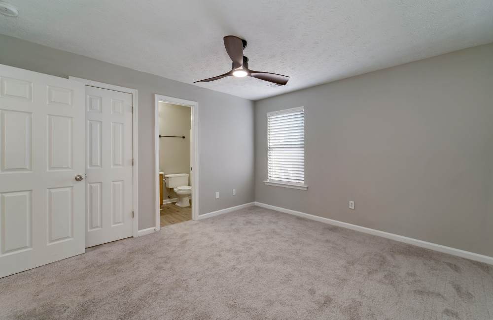 Well-lit bedroom at The Avenue in Cartersville, Georgia