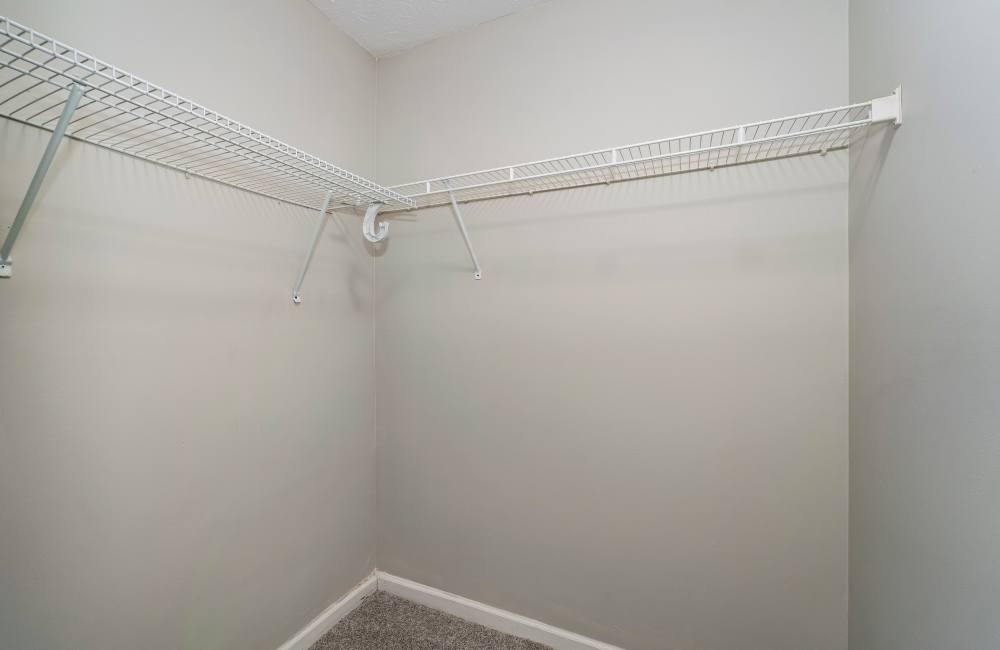 Bedroom with a walk-in closet at The Avenue in Cartersville, Georgia