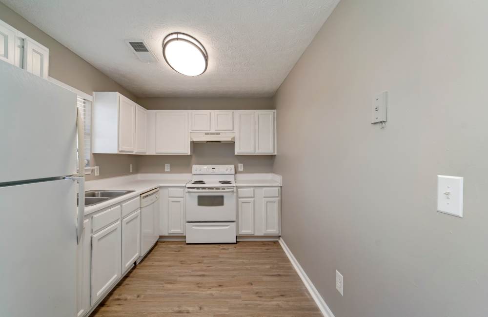 Modern kitchen with granite countertops and stainless-steel at The Avenue in Cartersville, Georgia