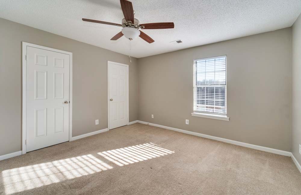 Bedroom with large windows at Collins Pointe in Cartersville, Georgia