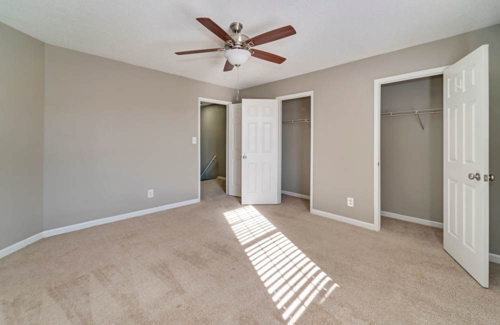 Spacious bedroom with walk-in closet at Collins Pointe in Cartersville, Georgia