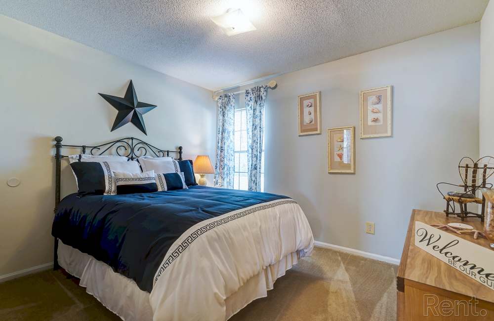 Bright bedroom with window at Pine Lakes in , South Carolina