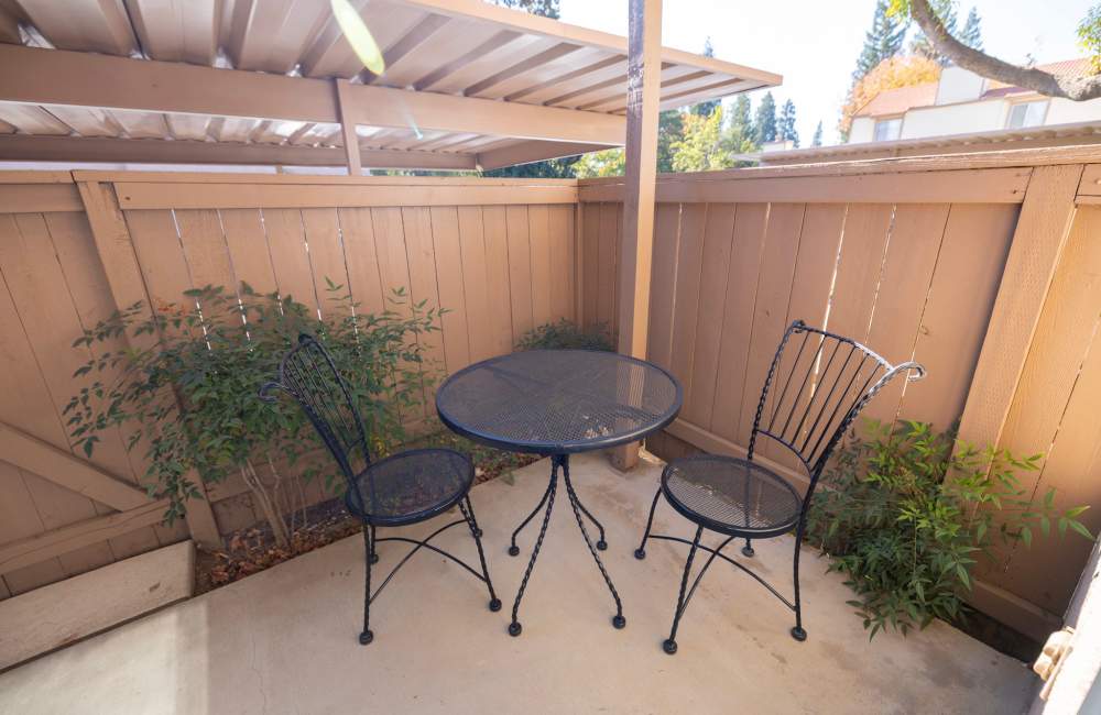 Private patio with chairs at Terrace View Apartments in Fresno,California