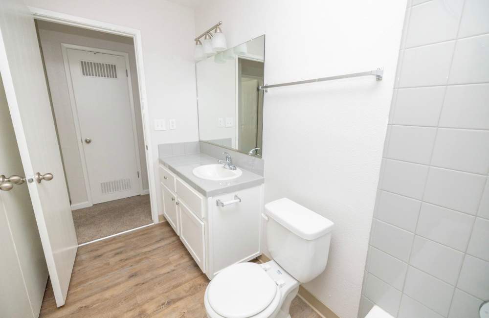 Bathroom with white vanity unit at Terrace View Apartments in Fresno,California