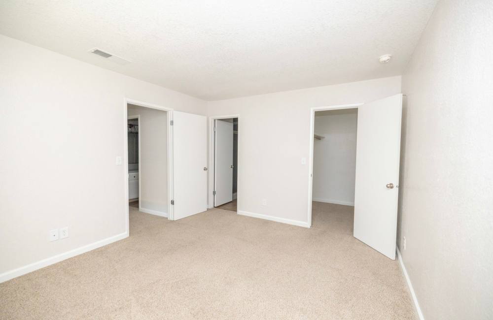 Bedroom with walk-in closet at Terrace View Apartments in Fresno,California