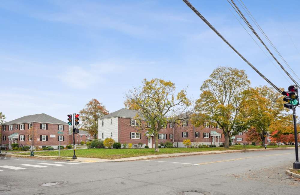 Community exterior view with entrance gate  at Arlington Gardens in Arlington, Massachusetts