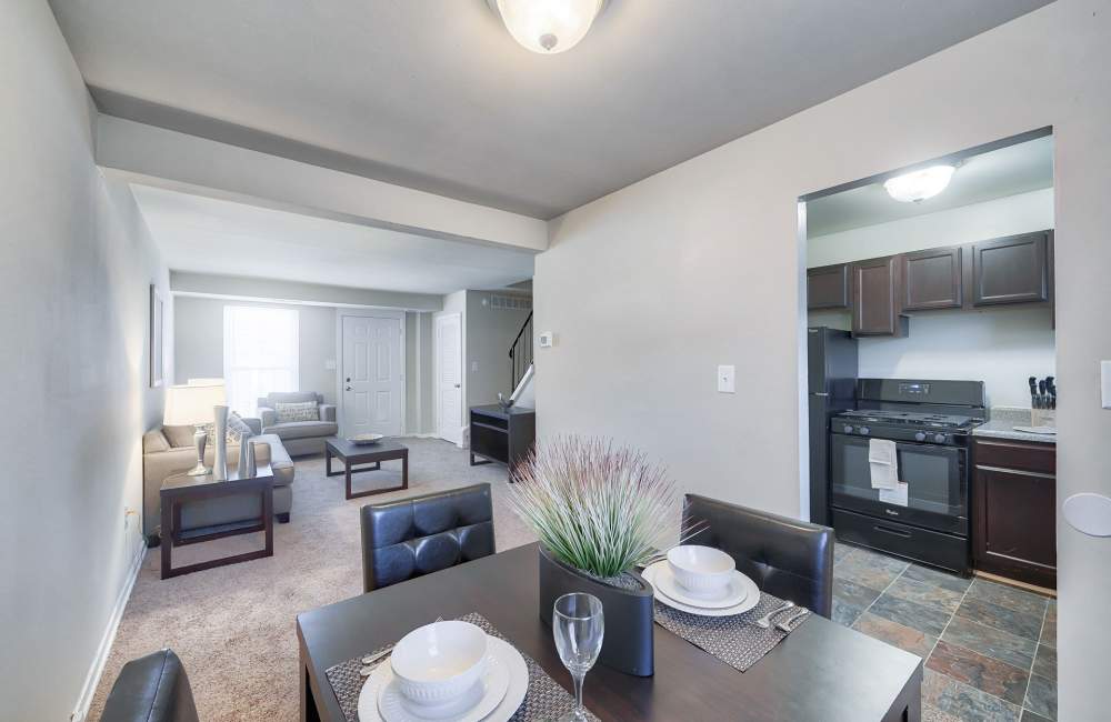 Spacious living room and the dining area at Northwest Townhomes in Baltimore, Maryland