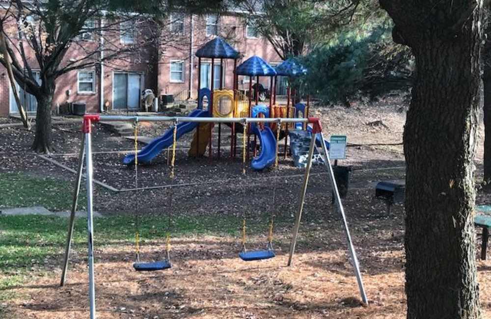 Swings in playground at Williston Townhomes in Baltimore, Maryland