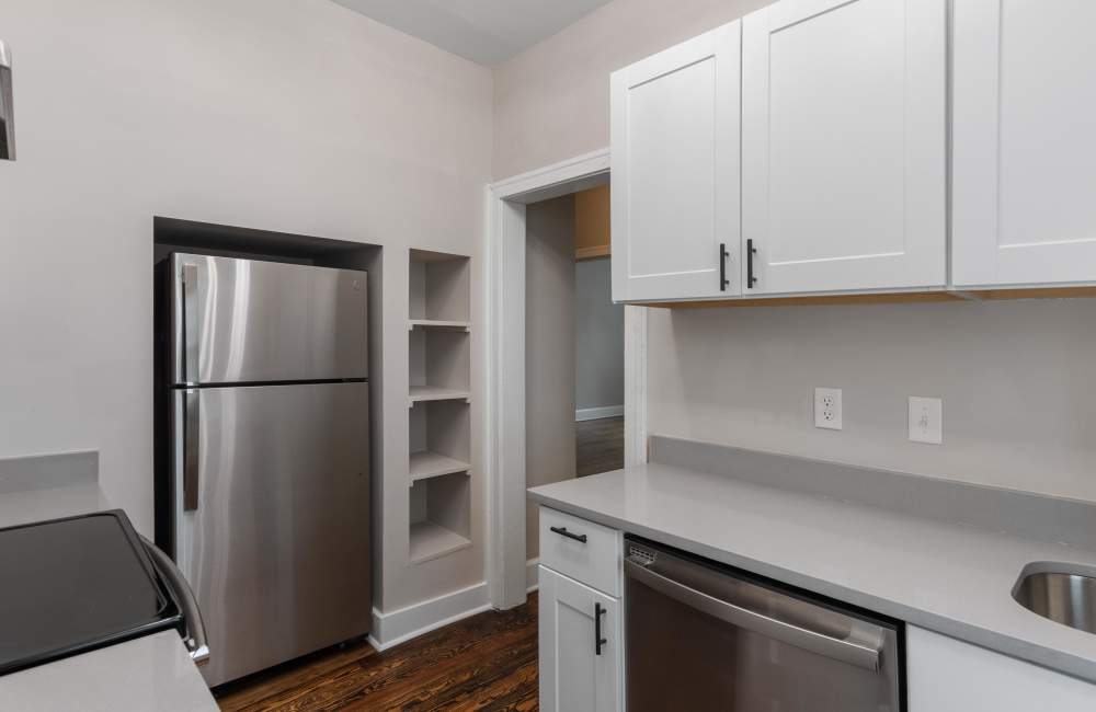 Modern kitchen with wood-style flooring at Stonewall Park in Memphis, Tennessee