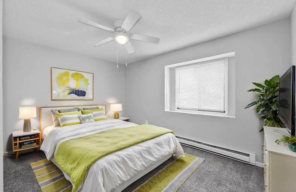 Bedroom with ceiling fan at Eastwood on Grand in West Des Moines, Iowa