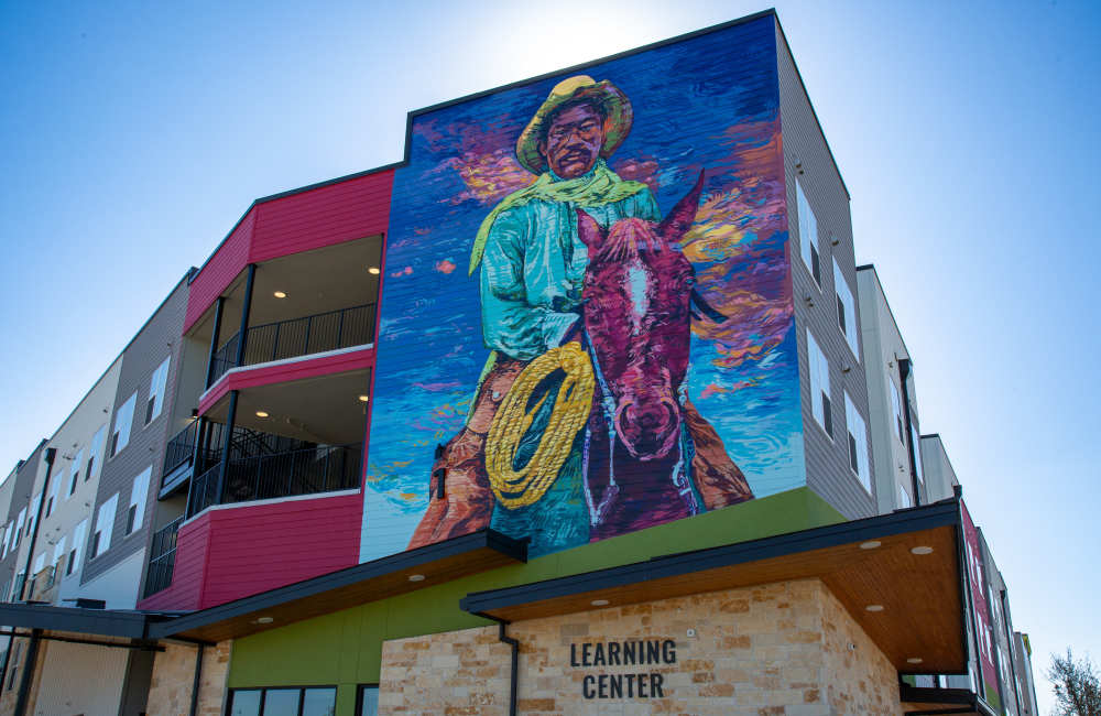 Apartment exterior wall art at Norman Commons in , Texas