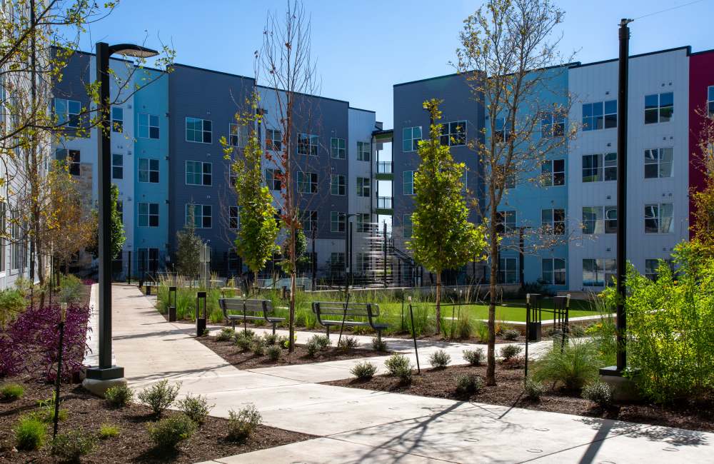 Apartment view with lawn area at Norman Commons in , Texas