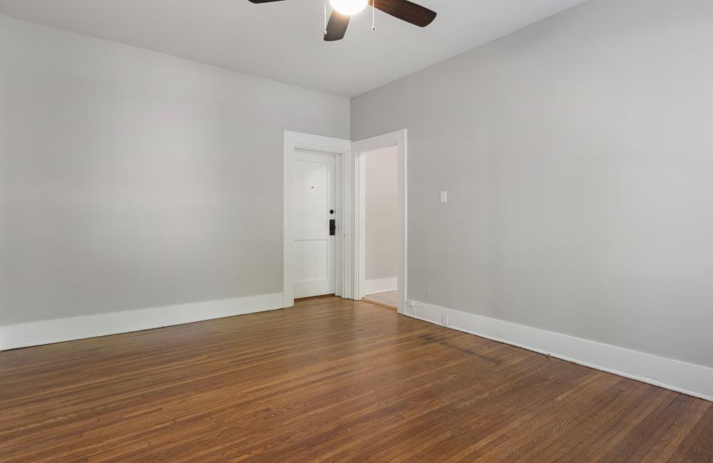 Unfurnished room with wood flooring and entry doors at The Alma in Memphis, Tennessee