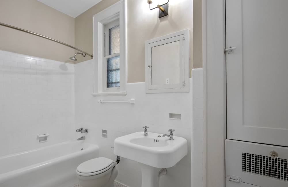 Bright bathroom with shower and tub at The Linden in Memphis, Tennessee