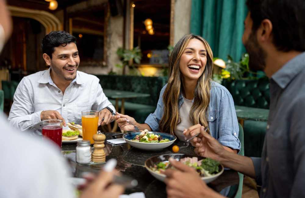 Residents enjoy a meal on the patio near Seven17 Lehman in Houston, Texas