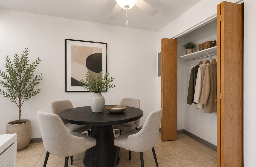 Dining area with round table and chairs at Elm Village in Urbandale, Iowa