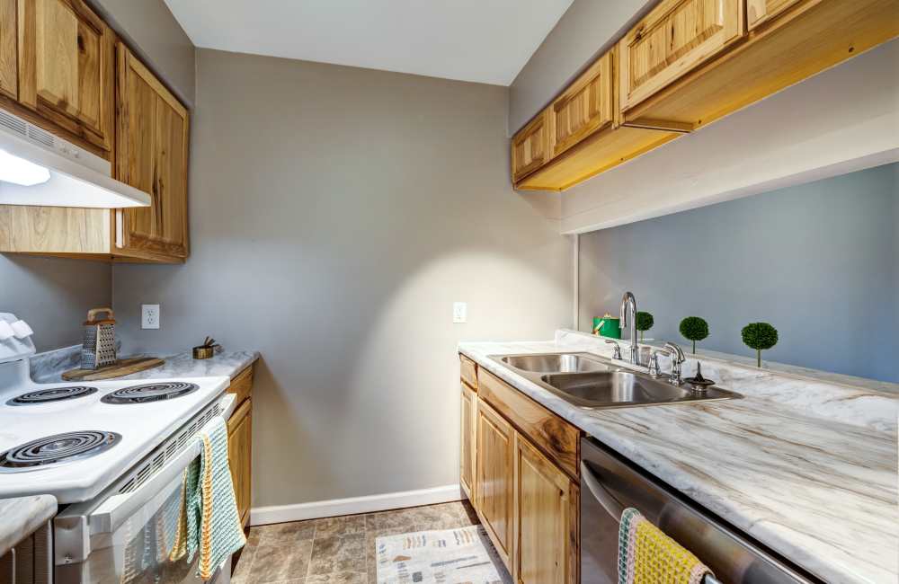 Fully-equipped kitchen with a breakfast bar at The Commons at Kettering in Dayton, Ohio