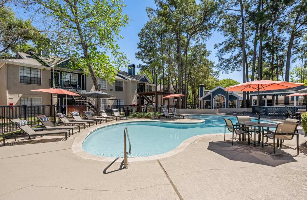 Resort-style swimming pool at The Reston Apartments in Conroe, Texas 