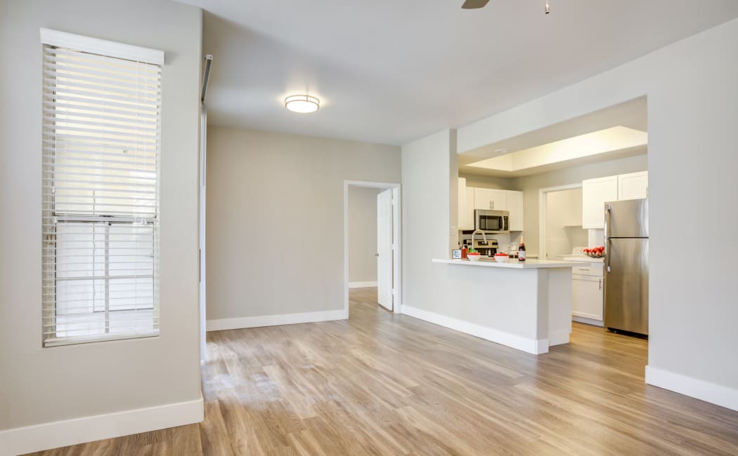 Living room with a kitchen view at Lumiere Chandler in Chandler, AZ