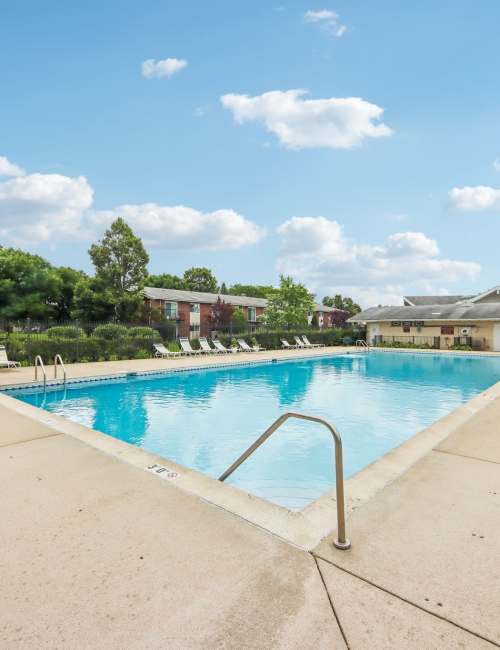 Swimming pool with sun loungers at Park Ridge Commons in Des Plaines, Illinois