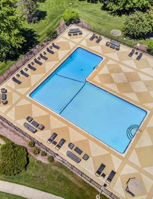 Swimming pool with sun loungers at Terraces of Elk Grove in Elk Grove Village, Illinois 
