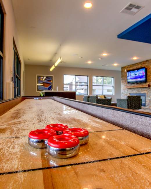 Resident lounge with games and tv at The Landing at College Station in College Station, Texas