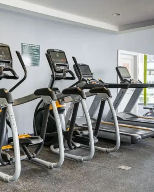 Community fitness center with cardio equipment at The Landing at St. Louis in Saint Louis, Missouri