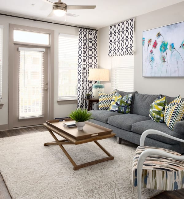 An apartment living room with a couch at The Highland in Augusta, Georgia